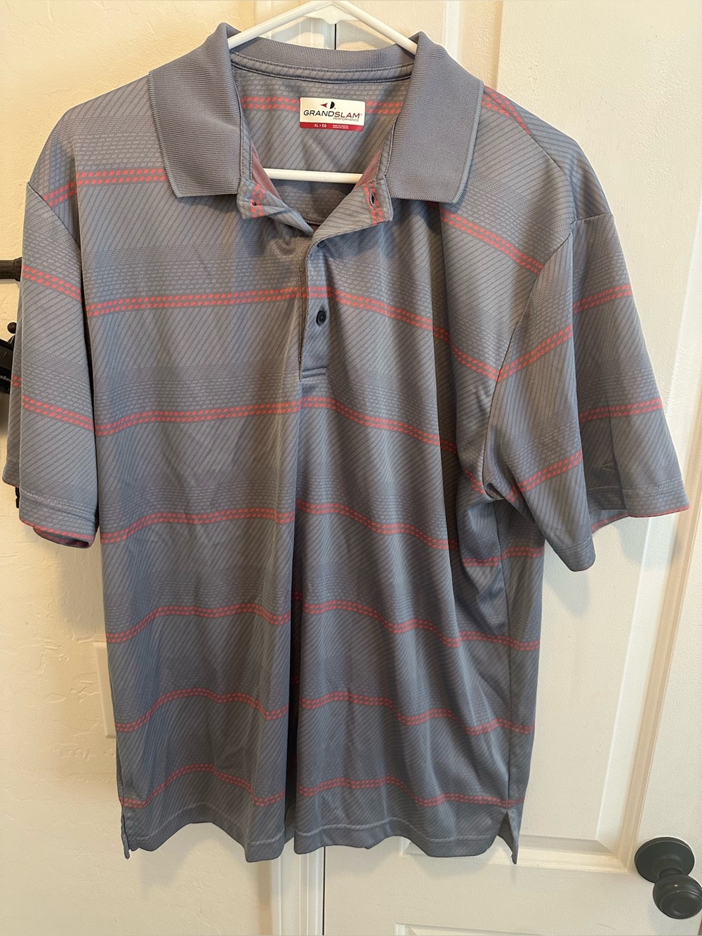 Men’s grey and orange striped polo shirt by Grand Slam size XLarge